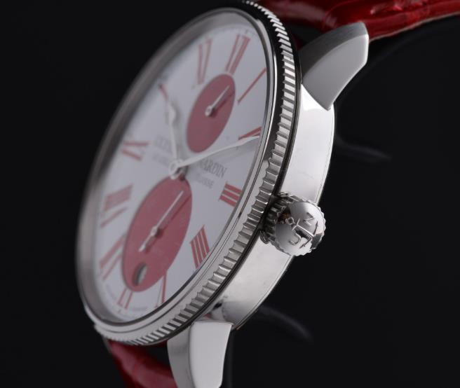The stainless steel fake watch has a red strap.